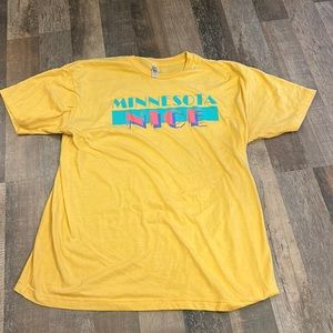 Woman’s yellow T-shirt with “Minnesota Nice” saying; worn twice